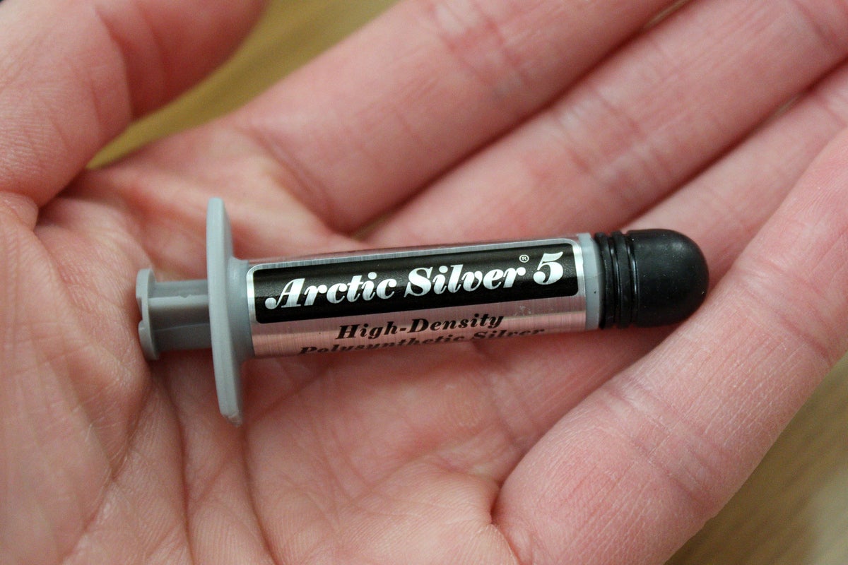 Tube of thermal paste in a woman's hand