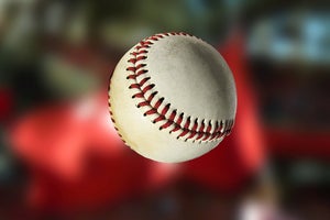 Baseball in front of a penant