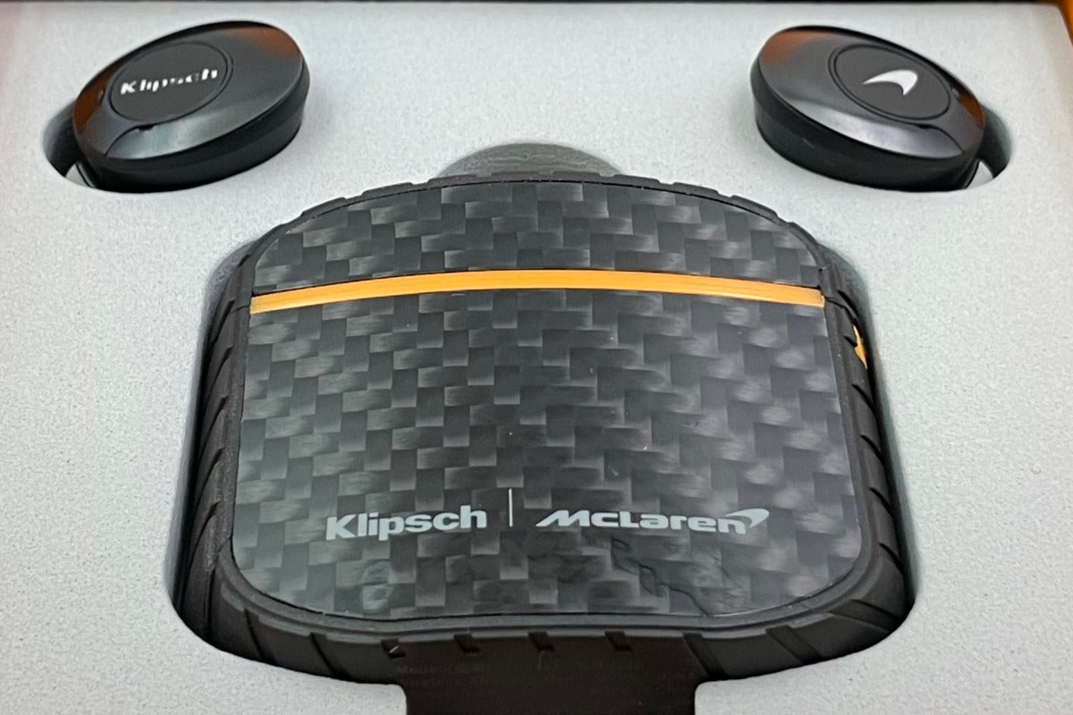 The carbon fiber detail on the McLaren Edition charging case and the company logos on each earbud.
