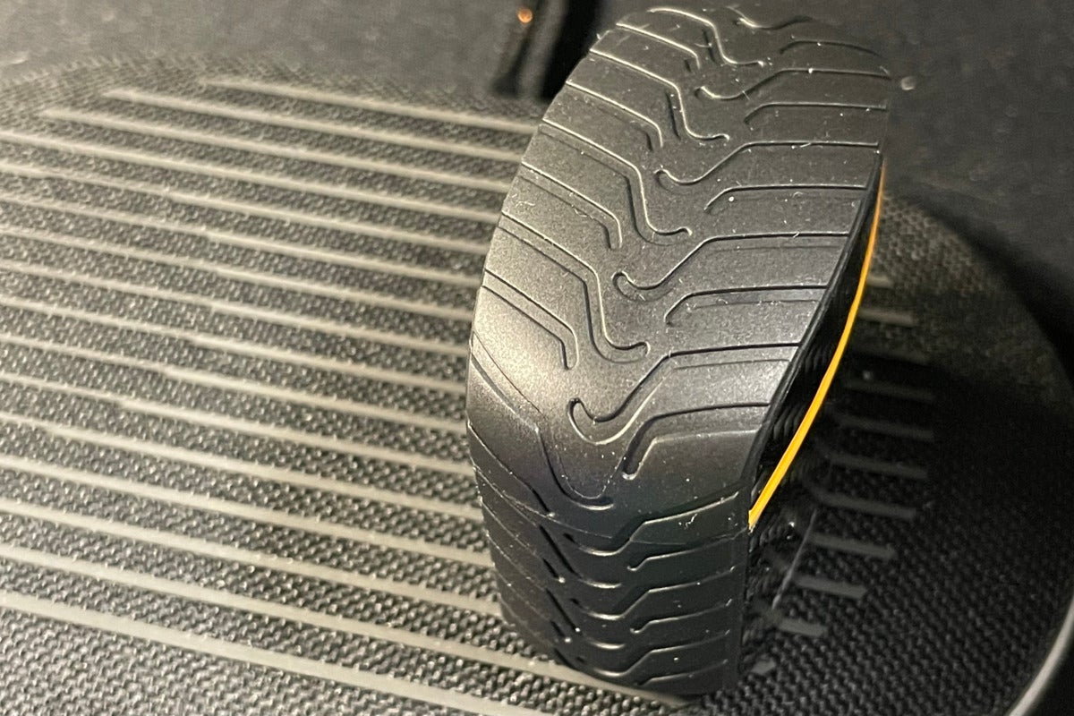 Detail view of the distinctive tire tread on the perimeter of the case.