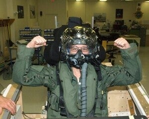 Teresa Merklin stands in for a female pilot during an F-35 ejection seat safety system design eval