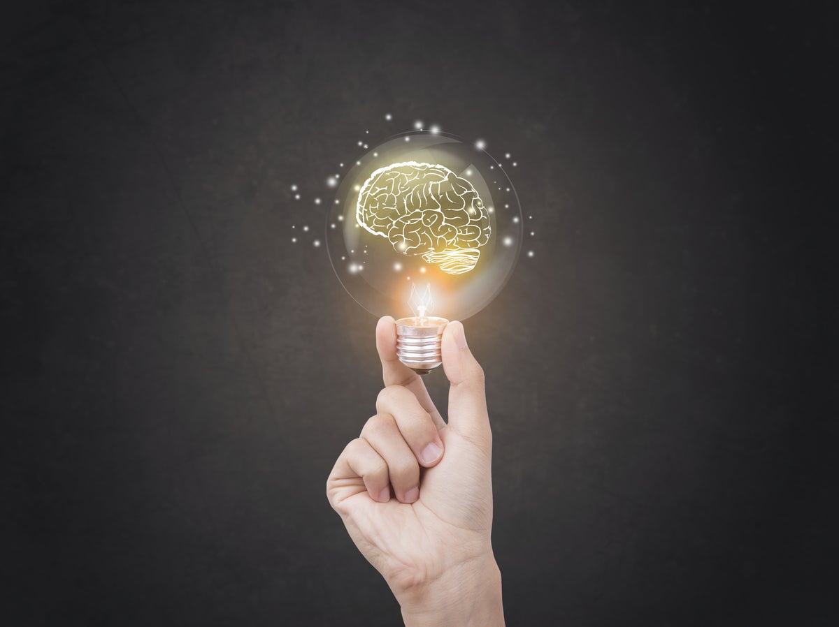 lightbulb brainstorming creative idea abstract icon on business hand