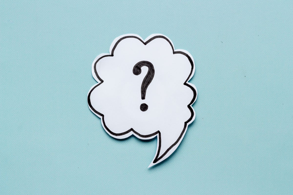 Question mark symbol on speech bubble, top view