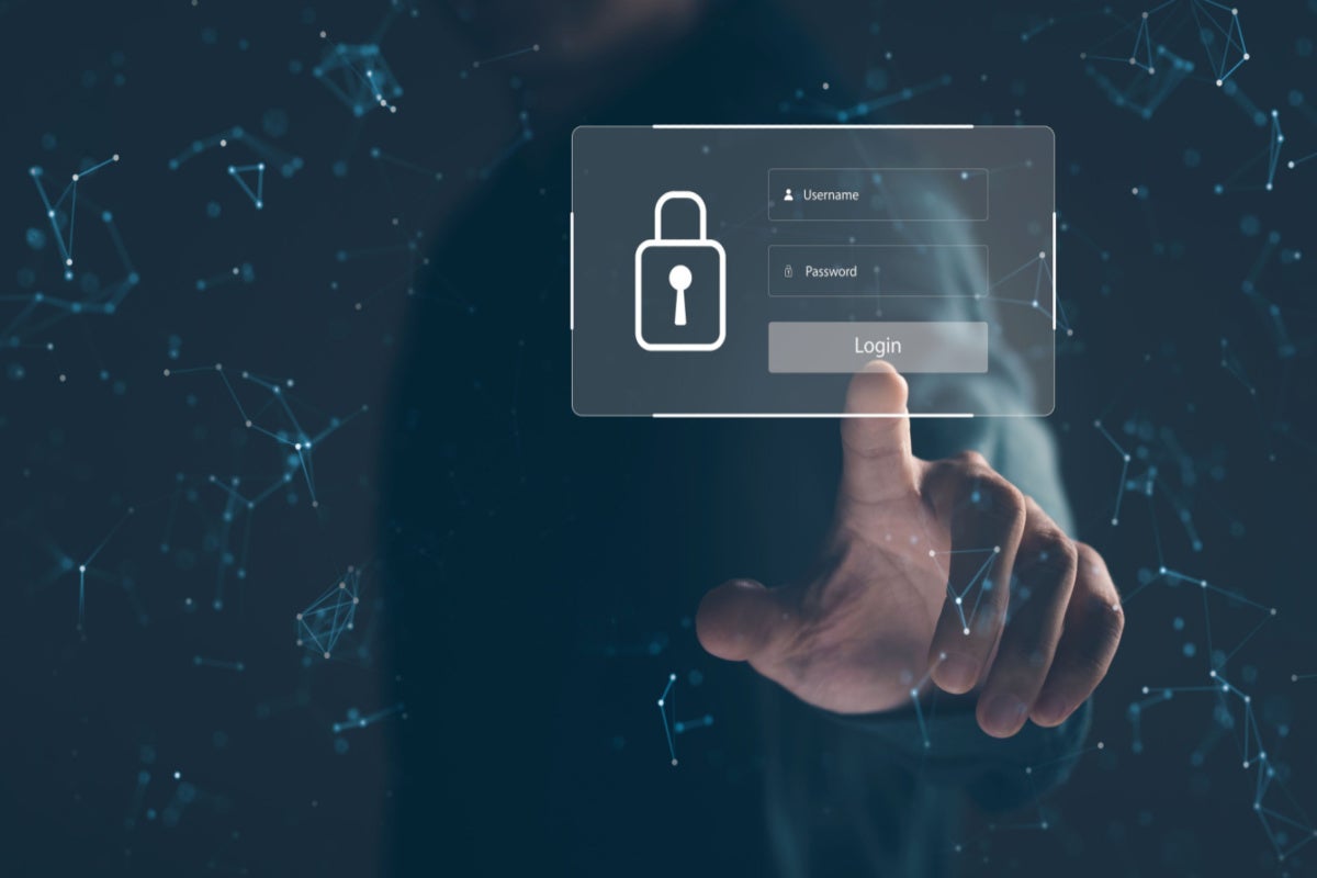 A businessman reaching out to touch a user type login, and password