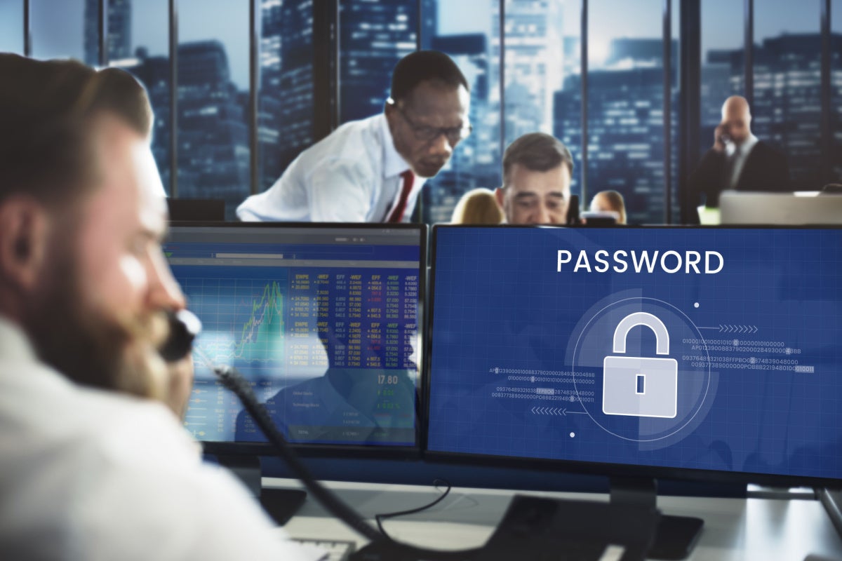 Workers working on computer that says Password and has a lock icon
