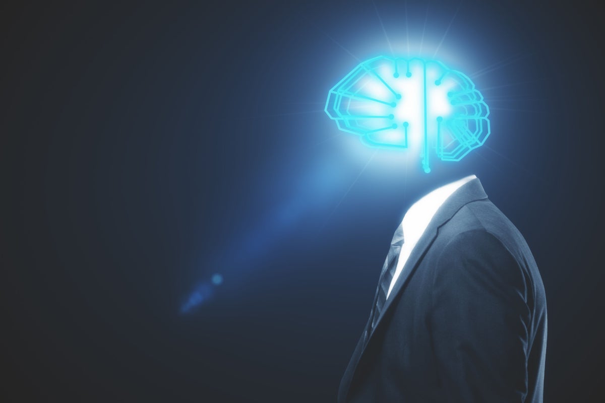 Side view of businessman with illuminated brain sketch instead of head on grey background