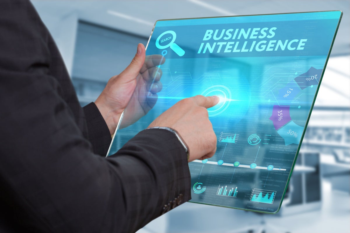 Business man working on the tablet, select on the virtual display: Business intelligence