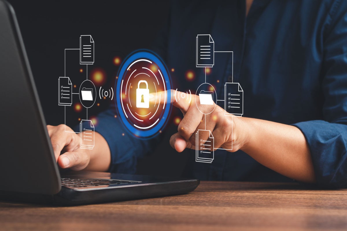 Online security concept. Businessman touching lock icon to access data. authentication