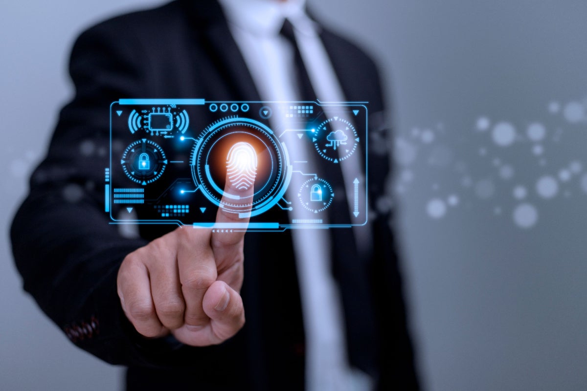 Businessman touching fingerprint scan. Concept for identity management