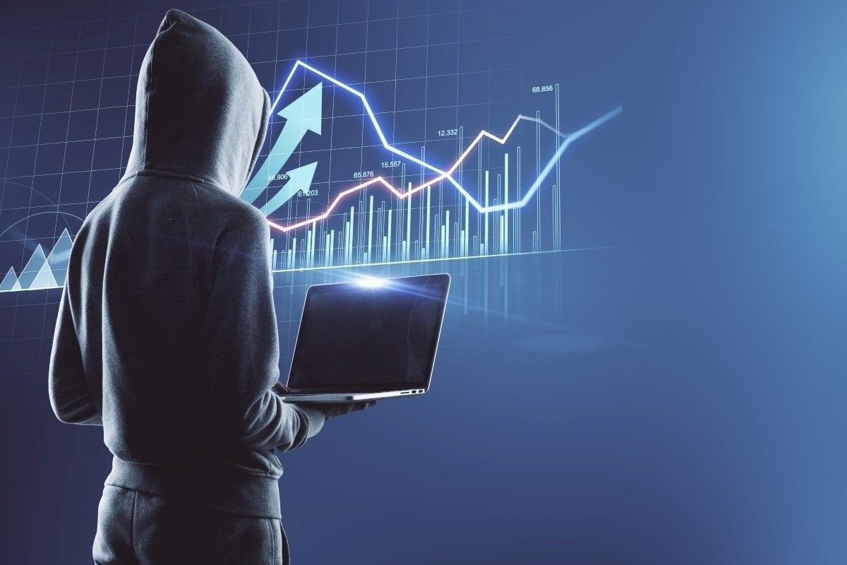 shadow stock market business laptop virtual screen with financial chart quotes and graphs attacker