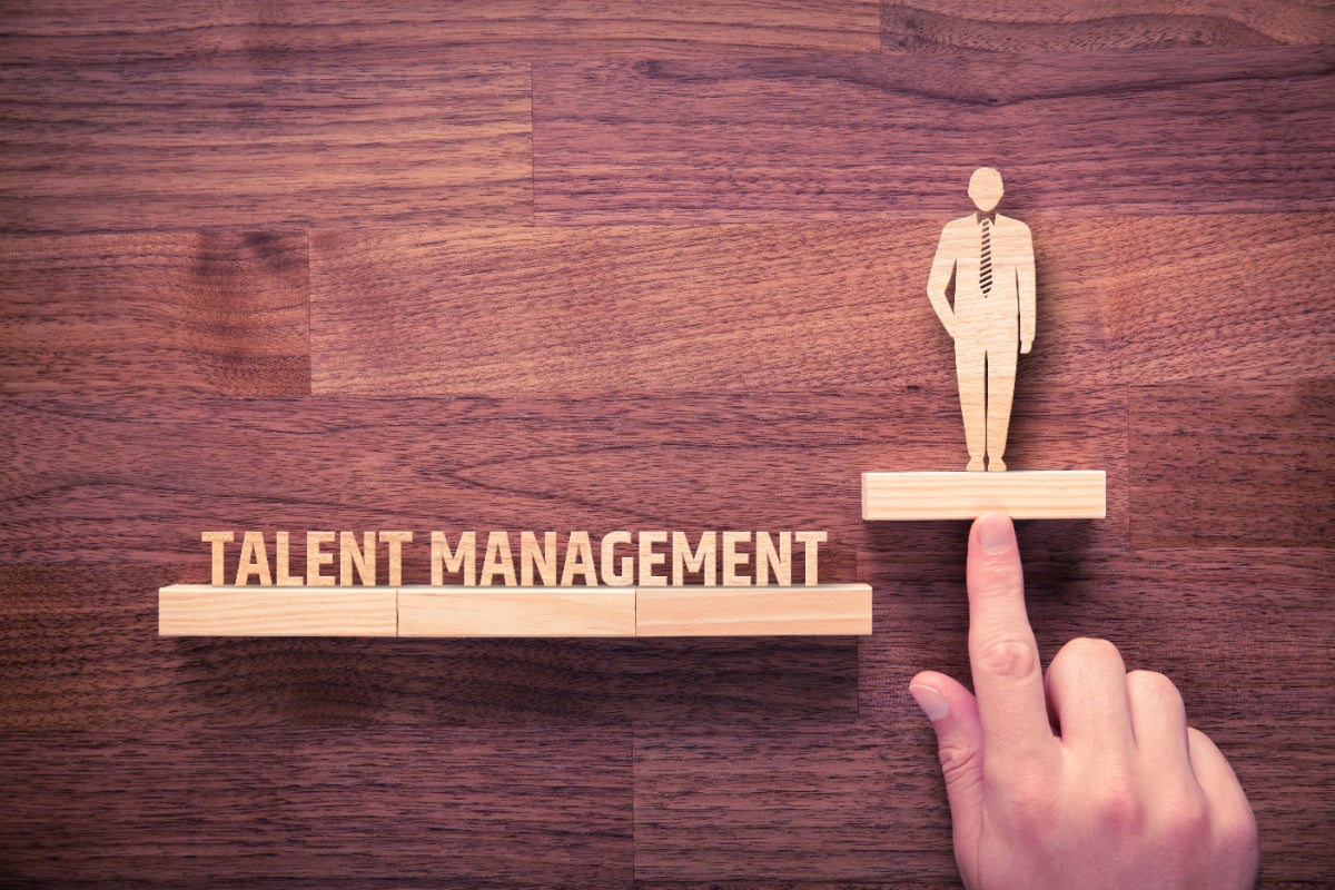 Talent management concept - wooden block of businessman