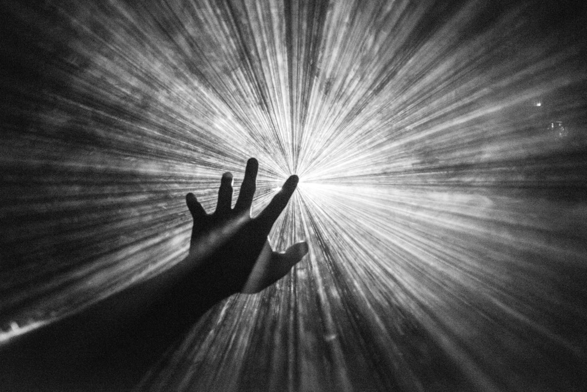 aspiration; vision; hand reaching for the light