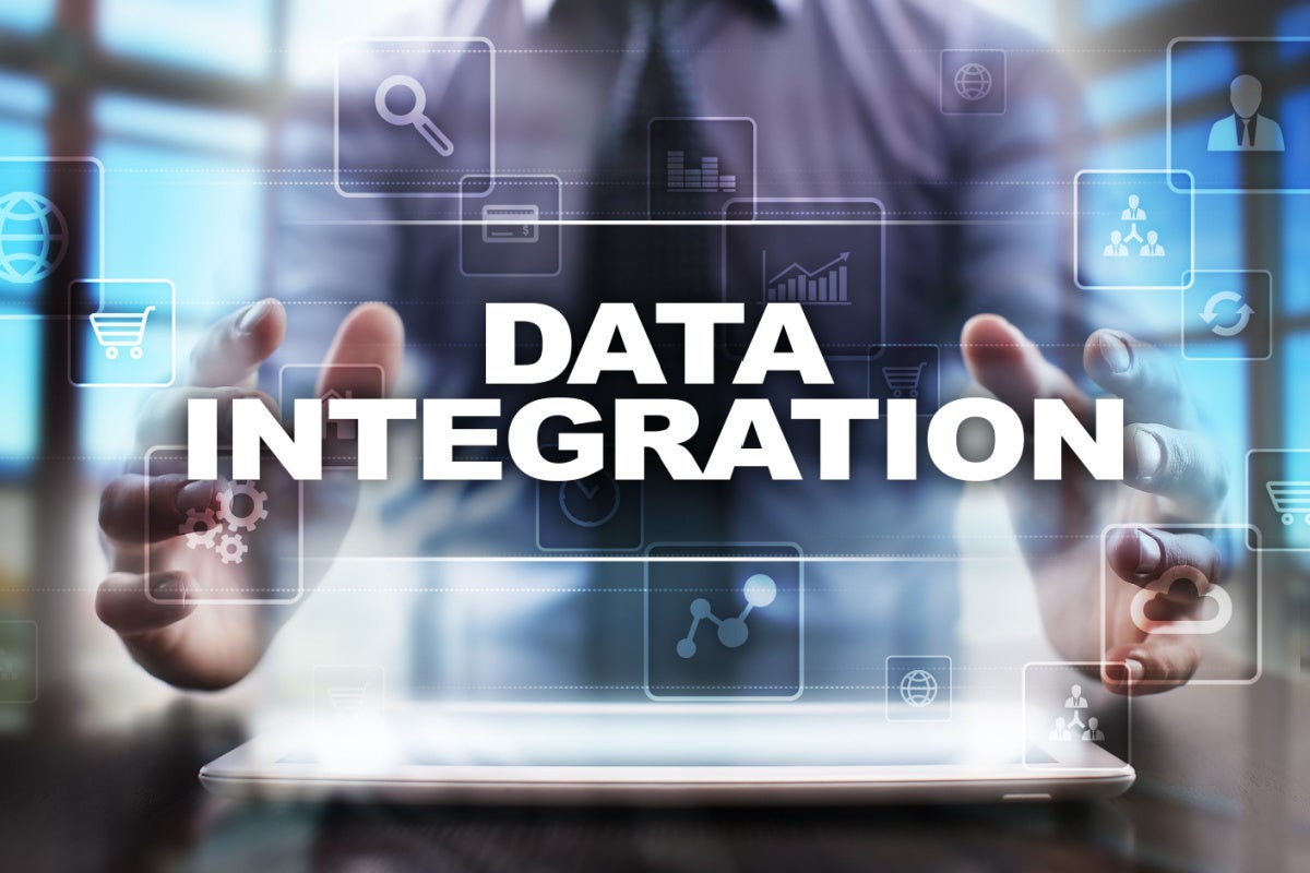 Businessman using tablet pc and selecting data integration