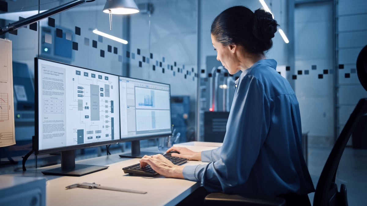 Industrial Engineer Working on Computer