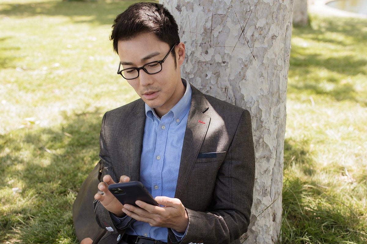 businessperson using iphone by rdne stock project via pexels