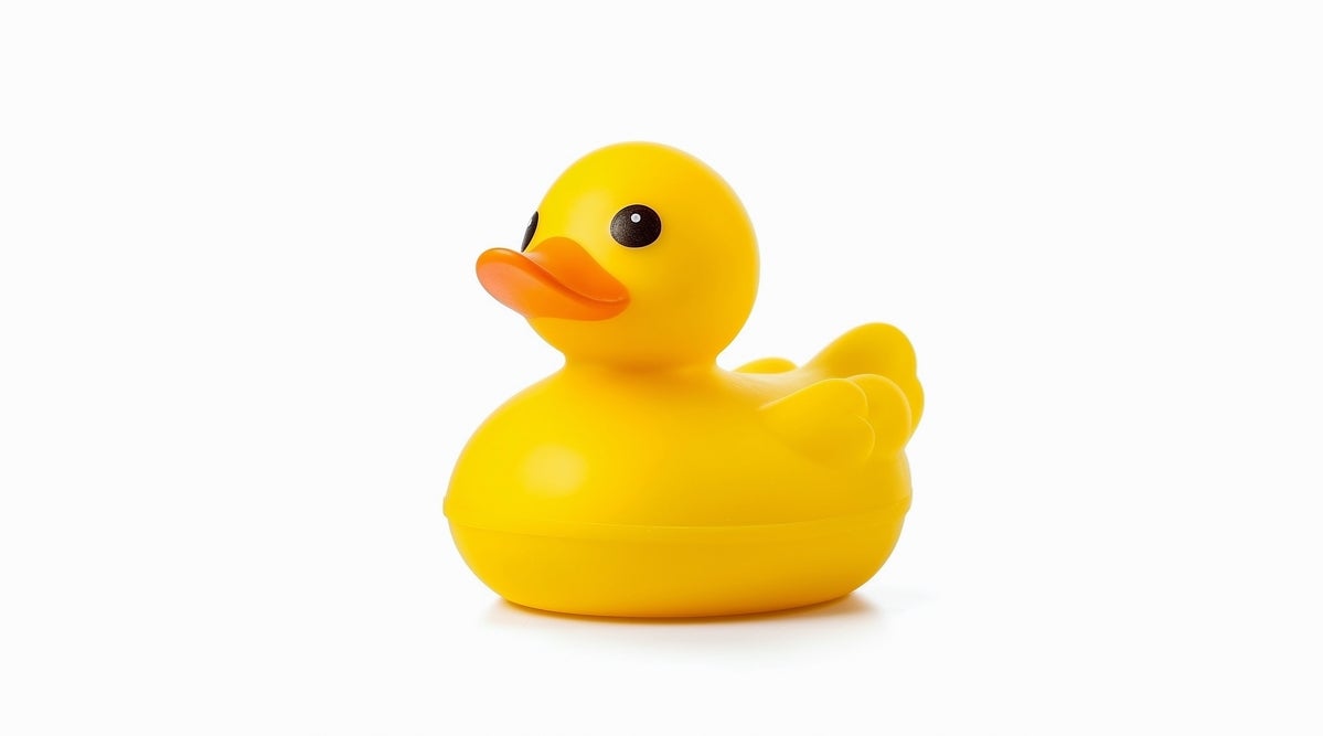 shutterstock 2288028173 yellow rubber duck on white background