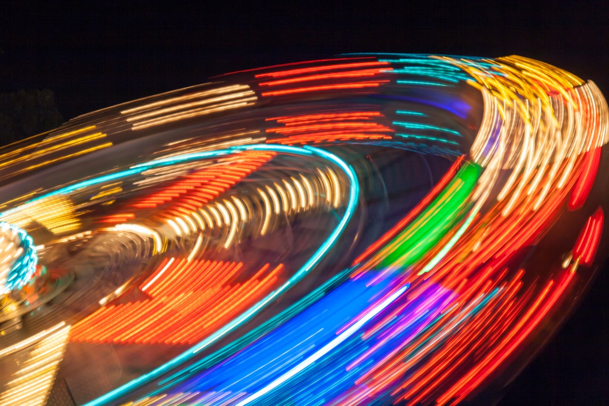 shutterstock 288379226 time-lapsed photo of spinning carousel at night