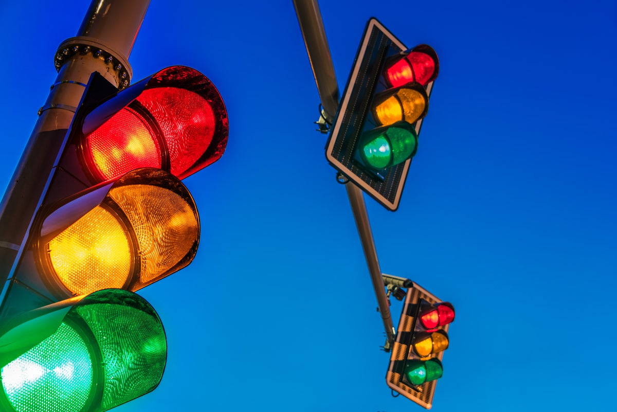 shutterstock 1801533685 multiple overhead traffic lights against an evening sky