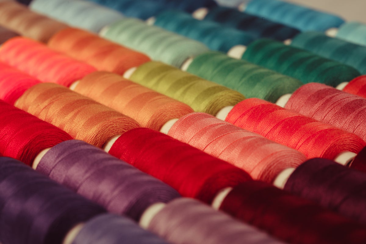 shutterstock 365534981 closeup of colorful sewing threads on spools