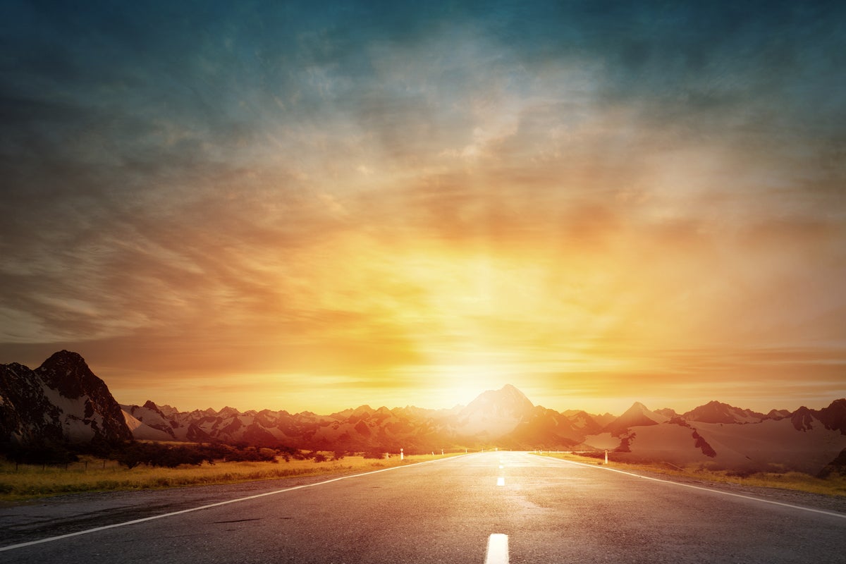 shutterstock 293703398 driving into the sunset two lane road in natural landscape heading due west