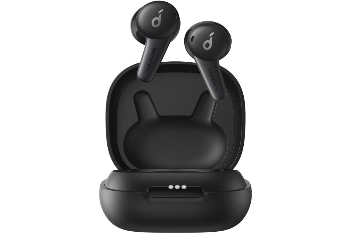 A pair of wireless earbuds suspended above their charging case.
