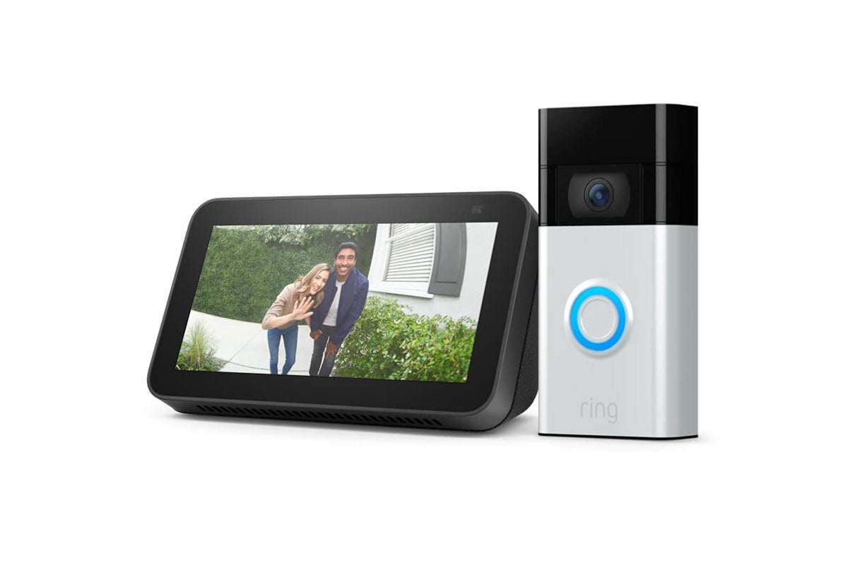 A silver ring doorbell standing next to the Echo Show