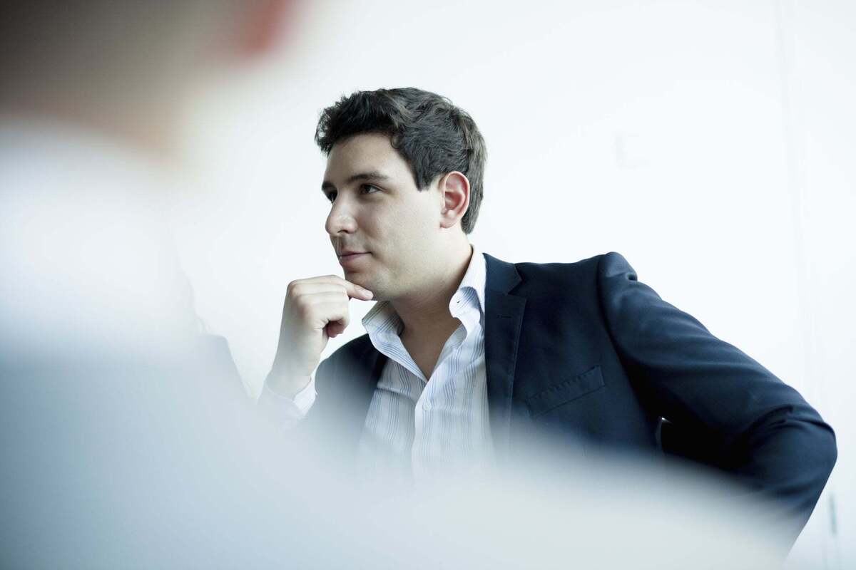 Man thinking in office meeting