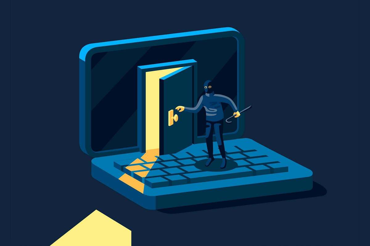 Security threat [illustration]  >  A hacker with black hat, mask, and crowbar breaks into a laptop.